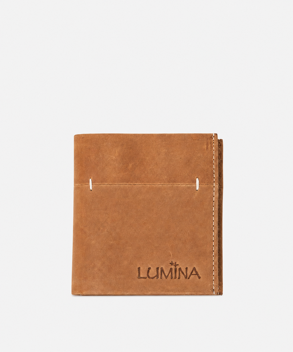 A tan leather bifold wallet with the brand name 'LUMINA' debossed on the front, shown against a plain light gray background.
